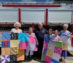 Going to Pieces Donates Quilts to PFD