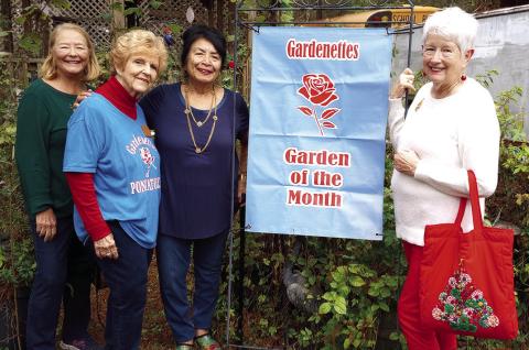 Gardenettes awarded Garden of the Month to Vicky Fannaly, 41411 S. Range Road. Present for the award were Mary Hirsch, Marilyn Wright, Vicky Fannaly, and Garden of the Month chairman Margaret Bailey.