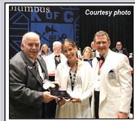 K of C State CYLA Chairman Delmas Forbes (left) and State Deputy Bobby Charpentier (right) present Hunter Grace Layrisson with a plaque and a $5000 check