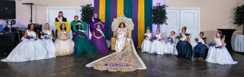 Omega XXXVIII Royal Court, left to right: Teen Princess Janae Feimster, Teen Princess Gracie Coyne, Gold Duke Eddie Lamparski, Gold Maid Baily Gordon, Green Duke Curt Zeller, Sr, Green Maid Keysha Robinson, Purple Duke Rodney Randall, Purple Maid Barbe Castjohn, Omega XXXVIII Queen Christina Larkin, Jr Princess Chevie Lamparski, Jr Princess Lylah Gordon, Jr Princess Clarke Gordon, Jr Princess Jade Williams-Dyson, Jr Princess Jackson Simon, and Jr Princess Ayva Bankston