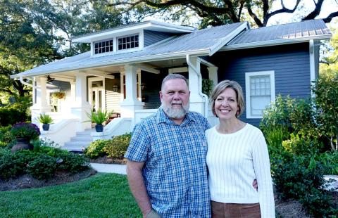 Mike and Rachel Rogers stand in front of their house at 717 East Charles Street, which will be the first stop on the 2025 Holiday Tour of Homes.