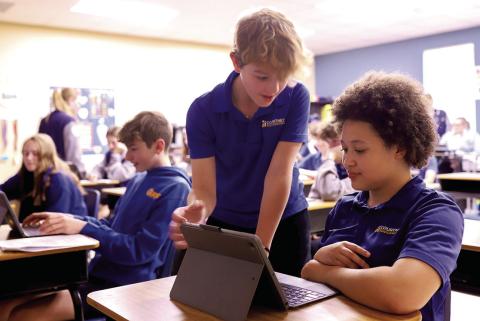 Eighth-grade students, Josiah Webre and Jada Hart, work diligently in language class (Photo Courtesy of Angie Johnson, CCS)