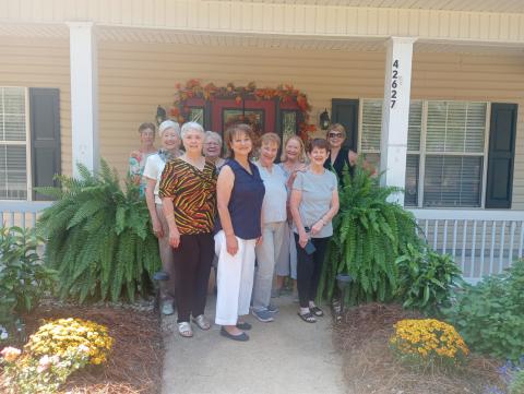 (Photo by Vicky Fannaly): Garden of the Month honors for September went to Jay and Gwen Prevost Anderson on Brown Road. Gardenettes gathered to present the award were Cricket Ayala, Margaret Bailey, Susan Pizani, Ellen Pusey, homeowner Gwen Prevost Anderson, Virginia Hawkins, Mary Hirsch, Karen Hotard, and chairman for the event, Darnell Kimber.