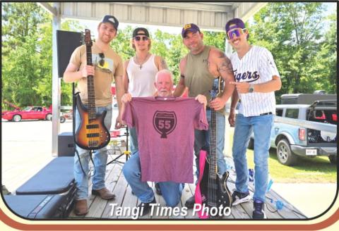 Above, TPSO CID Detective Mike Johnson, center, poses with the members of local southern rock band Northbound 55, who performed free of charge at his fundraiser on Saturday. At the end of their set, the band donated their tips to Mike and presented him with a complimentary T-shirt displaying the band’s logo.