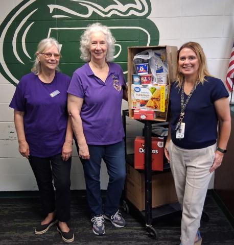 WVFC members, Jean Johnson and Jean Hebert deliver donations to a Ponchatoula High School Administrator. (Courtesy photo)