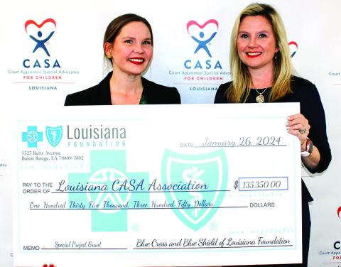 Chloe Wiley, Initiatives Manager at The Blue Cross and Blue Shield of Louisiana Foundation, presenting the check to Amanda Moody, Executive Director at Louisiana CASA.