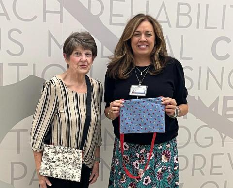 Karen Hotard, Gardenette chairman, delivers 70 Bosom Buddy bags to Staci Arceneaux, liaison for North Oaks Hospital for cancer and surgery patients to hold their drip bags. (Courtesy Photo)