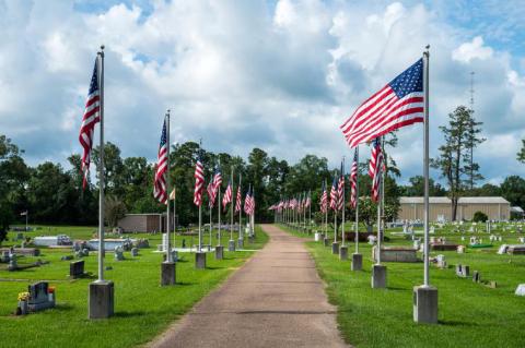 American flags in Ponchatoula Cemetery were raised at 8:00am and lowered at 5:00pm by American Legion Post 47 on Independence Day.
