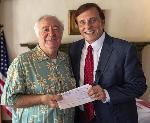 LA State Treasurer John Fleming (right) personally delivered an unclaimed money check to Alessandro Pieri (left) last Tuesday. (Courtesy Photo)