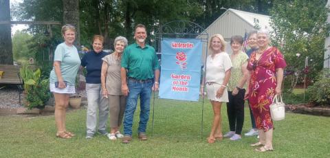 Presenting the award were Garden of the Month Chairman Darnell Kimber, Virginia Hawkins, Marilyn Wright, homeowners Braville and LouAnn Leblanc, Karen Hotard, and Gardenette president Susan Pizani. (Courtesy Photo)