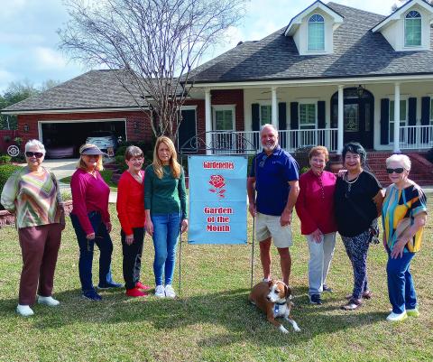 Cindy and Darin Helms were awarded January Garden of the Month. Pictured at the presentation were Gardenettes president Susan Pizani, Mary Hirsch, Karen Hotard, homeowners Cindy and Darin Helms, Virginia Hawkins, Vicky Fannaly, and Linda Fabre. Photo was taken by Darnell Kimber, club chairman.