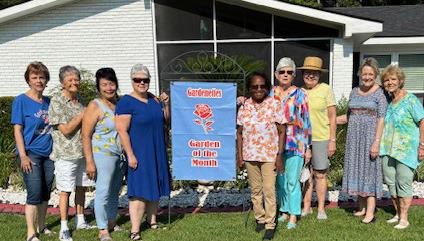 Pictured are Carol McGough, Sunday Hanson, Vicky Fannaly, Susan Pizani, homeowner Martha Davis, Margaret Bailey, Sandy Cusick, Jamie LeBlanc, and Marilyn Wright. Photo by Cricket Ayala. (Photo Courtesy of Cricket Ayala )