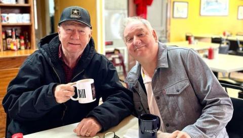 At right, former Café owner Bill Parsons and current owner John Miller meet for coffee and conversation in The Café prior to the October 12 fire that substantially damaged the restaurant.