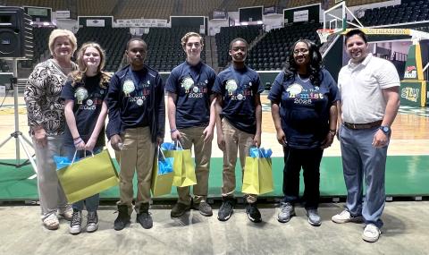 Second Place Lucille Nesom Memorial School team poses with School Board member Joey Piazza (left) and School Superintendent Melissa Stilley (right) (Courtesy Photo)
