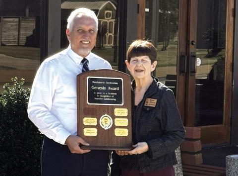 Genesis Award winner Lance Vicknair, owner of Harry McNeely and Son Funeral Home and Crematory, received the Genesis Award from Gardenettes chairman Darnell Kimber. (Photo taken by Karen Hotard)