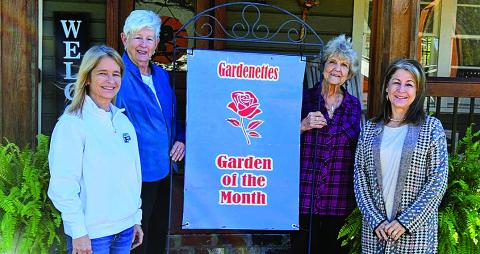 Patricia Landaiche receives November Garden of the Month from the Gardenettes. Shown are Landaiche, Margaret Bailey, Marilyn Wright, and Andrea Wheat.