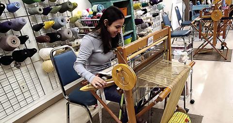 Weaving specialist, Calin, uses an old-world loom to create fabrics of her chosen design. Each panel of fabric will be cut and sewn into beautiful saleable products, such as towels, table runners, and wine bags. (Tangi Times Photo)