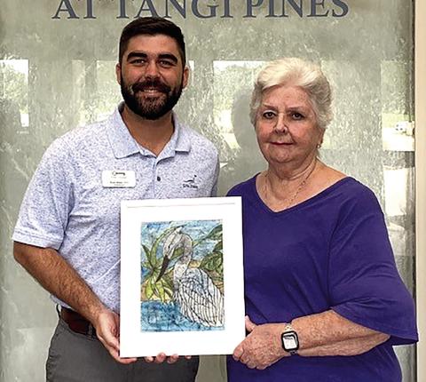 The Louisiana Growers in Amite, Rich and Susan Webb, donate a stunning painting acquired at the 63rd Annual Amite Art Show 2024 to The Lodge at Tangi Pines nursing home. Harriet Mayeaux, President of the Amite Art Club, presents the gift to Administrator Bond Babin. (Courtesy Photo)