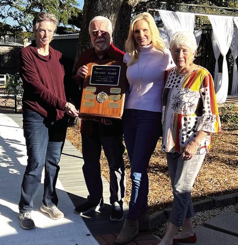 Gardenette chairman, Cricket Ayala, selected The Oaks Wedding and Event Center to receive the Genesis Award for outstanding landscaping. Representing the Center, Donald Jones and Missy Hammack received the plaque from Ayala and committee member, Margaret Bailey, right. (Courtesy Photo)