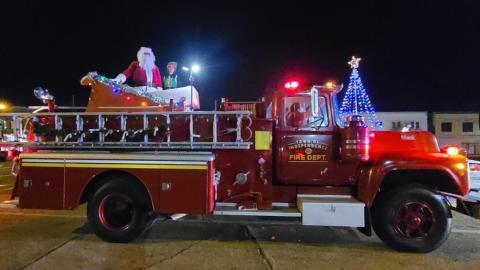 Santa and his elf pose after the Independence Christmas parade in front of the town’s Christmas tree in the heart of historic Independence. Tangi Times Photo