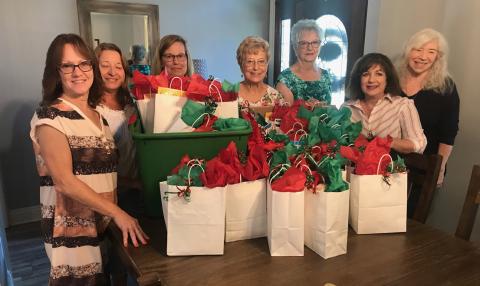 L to R: Sharon Miano, Julie Desselles, Gwen Domiano, Donna Bouterie, Sue Nelson, Susan Melacon, Jamie McDonald (Courtesy Photo)