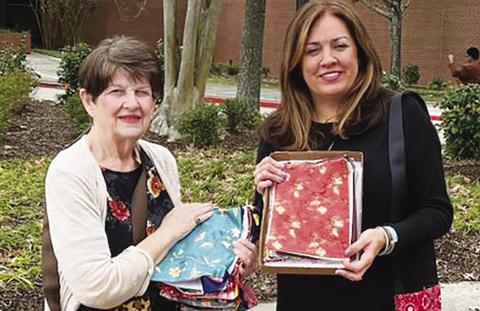 Gardenette chairman Karen Hotard, delivers 50 Bosom Buddy Bags for cancer patients to North Oaks Hospital Liason Staci Arceneaux. These colorful bags make a cheerful way to carry drip bags after surgery.