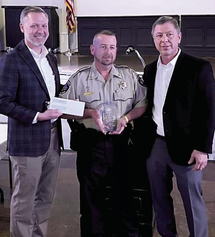 Lieutenant Sharkey (center) receives Deputy of the Year Award from Sheriff Daniel Edwards (right) and Brad Stevens (left) with the Hammond City Club. (Courtesy Photo)