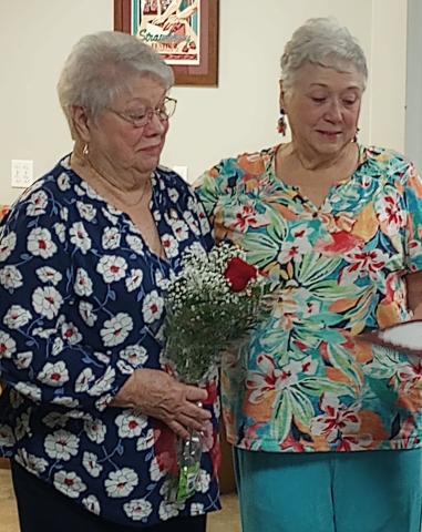 Shown with Circle of Roses honoree Ellen Larsen Pusey, Gardenettes president Susan Pizani spoke to the garden club on Tulip Mania a historic event where the price of tulip bulbs reached an astronomical high.