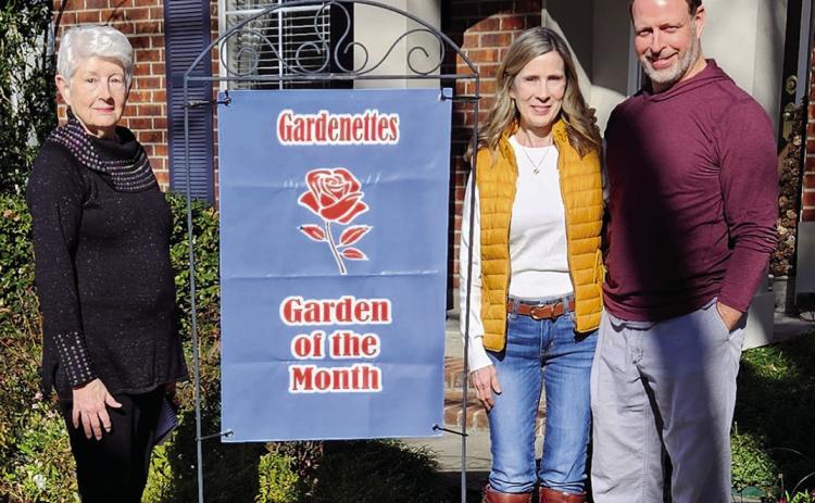 Gardenette chairman Margaret Bailey presents January Garden of the Month honors to Mary and Jay Ransom for their residential landscaping (Courtesy Photo)