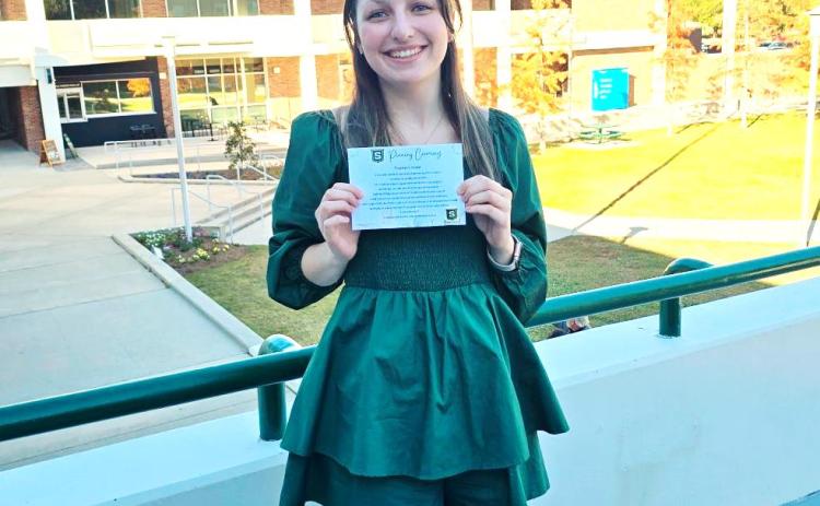 Southeastern education senior Kayla Simpson displays her certificate following the pinning ceremony on December 12, ahead of her final semester of teaching residency.
