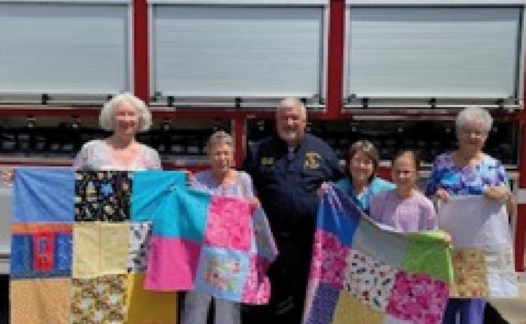 Going to Pieces Donates Quilts to PFD