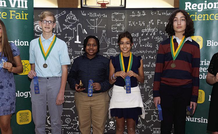Winners at the 2025 Region 8 Science Fair held at Southeastern Louisiana University Feb. 7 included, from left, Emma O’Rourke of Our Lady of Lourdes; Judah Fastring of Northlake Christian School; Landon Mack of Courtney Christian School; Dylan Mankinen of Northshore Preparatory Academy; Adam Lorenzen, homeschool; and Emily Cuccia of Northlake Christian School. (Courtesy Photo)