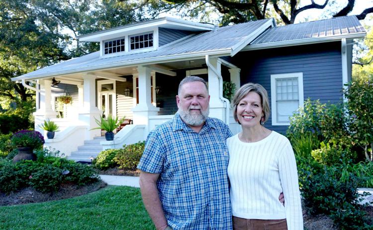 Mike and Rachel Rogers stand in front of their house at 717 East Charles Street, which will be the first stop on the 2025 Holiday Tour of Homes.