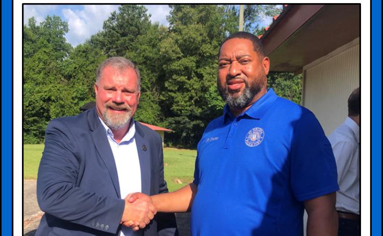 St. Helena Parish OEP Director Roderick Matthews, right, joins St. Helena Parish Sheriff Clay Chutz, left, at the sheriff’s first prayer breakfast in Greensburg.