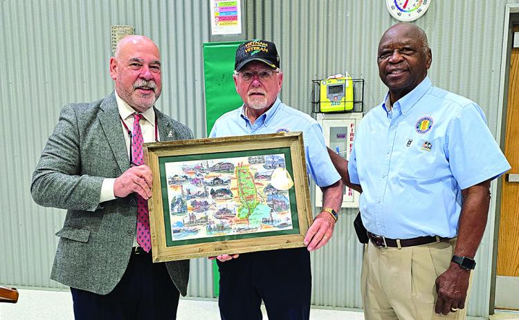 VVA Chapter 1052 presents a gift to guest speaker, Fernando Rivera Pictured, left to right: Guest speaker, Fernando Rivera; VVA Chapter 1052 president, Richard Neher; event emcee and coordinator, Parish Councilman, Louis Joseph, VVA Chapter 1052 (Tangi Times Photo)