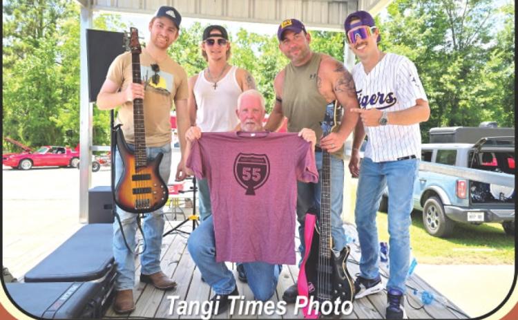 Above, TPSO CID Detective Mike Johnson, center, poses with the members of local southern rock band Northbound 55, who performed free of charge at his fundraiser on Saturday. At the end of their set, the band donated their tips to Mike and presented him with a complimentary T-shirt displaying the band’s logo.