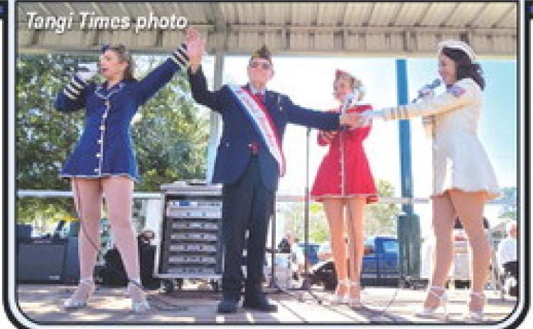 Parade Grand Marshal, 101-year-old George Van Zandt, is serenaded by the Victory Belles on stage in Ponchatoula’s Memorial Park.