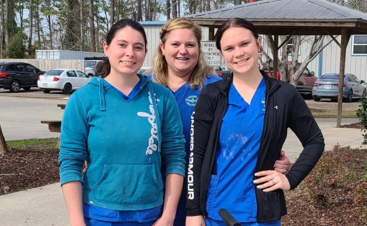 Tangipahoa Parish Animal Services (TPAS) girls, Daisy Voight, Dee Wilterberger, and Amber Huber, love their job of taking care of “the babies,” their affectionate nickname for their beloved shelter pets. Viewing themselves as foster parents of sorts, these wonderful girls work every day to find forever homes for the sweet animals in their care. Please call them at 985-543-0215 or visit https://tangipahoa.org/government/animal-services.
