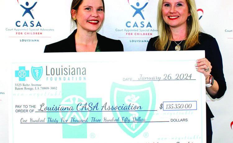 Chloe Wiley, Initiatives Manager at The Blue Cross and Blue Shield of Louisiana Foundation, presenting the check to Amanda Moody, Executive Director at Louisiana CASA.