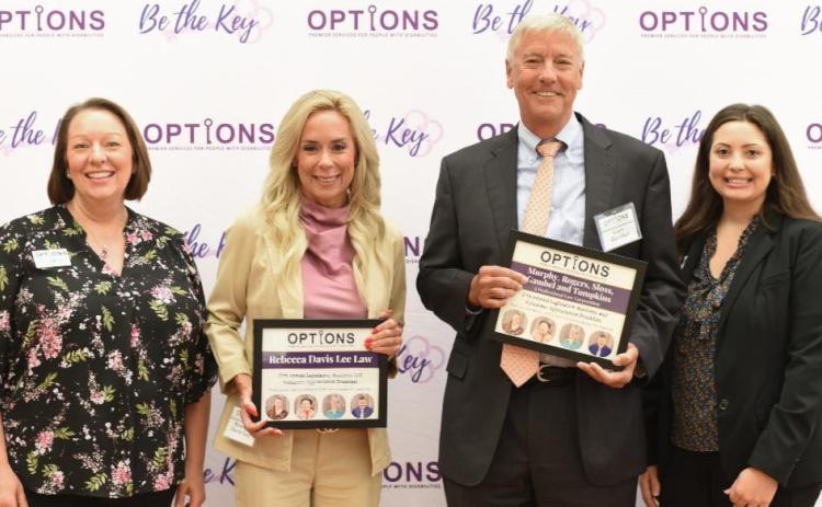 From Left to Right: Carrie Mercke, OPTIONS President and CEO; Rebecca Davis Lee and Gary Gambel, Event Sponsors; and Casey Rudolph, OPTIONS Development Director. ( Courtesy Photo)