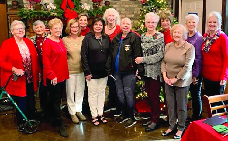 From left to right: Maureen Felder, Mitzie Verberne, Donna Bouterie, Gwen Domiano, Karen Moran, Gloria Messenger, Jean Hebert, Deputy Susie Cambre, Sue Nelson, Betty Bankston, Kathleen Hayman, Beverly Webre, Mille Meyers