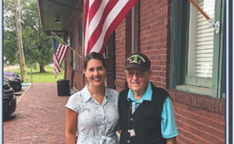 District 10 Tangipahoa Parish Councilwoman Strader Cieutat, left, poses with the grand marshal of the upcoming Ponchatoula Celebrates Veterans parade, WWII veteran George Van Zandt, right.