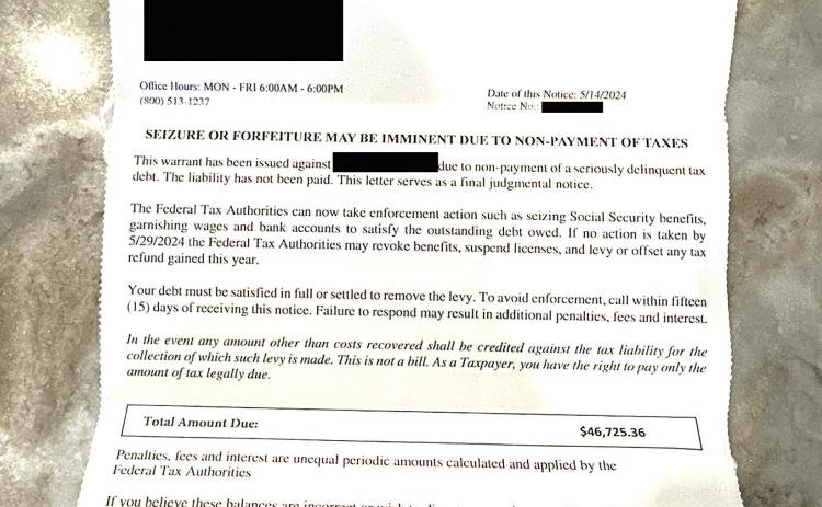 Photo of a letter received by the victim (personal information redacted)