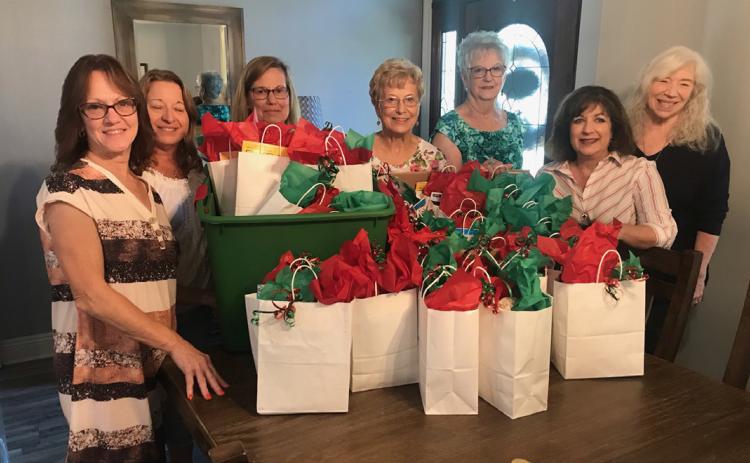 L to R: Sharon Miano, Julie Desselles, Gwen Domiano, Donna Bouterie, Sue Nelson, Susan Melacon, Jamie McDonald (Courtesy Photo)