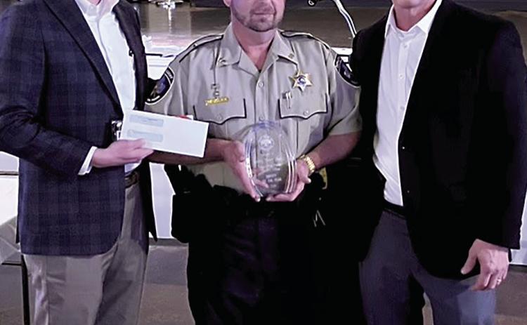 Lieutenant Sharkey (center) receives Deputy of the Year Award from Sheriff Daniel Edwards (right) and Brad Stevens (left) with the Hammond City Club. (Courtesy Photo)
