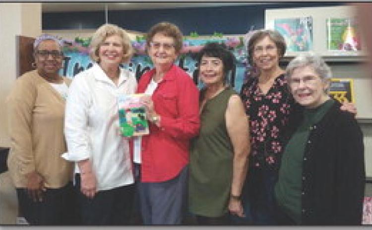 Shown are Librarian Wanda Davis, garden club chairman Carolyn Todd, Author Martin, Vicky Fannaly, President Sandy Grimm, and Rose Doles. (Courtesy Photo)